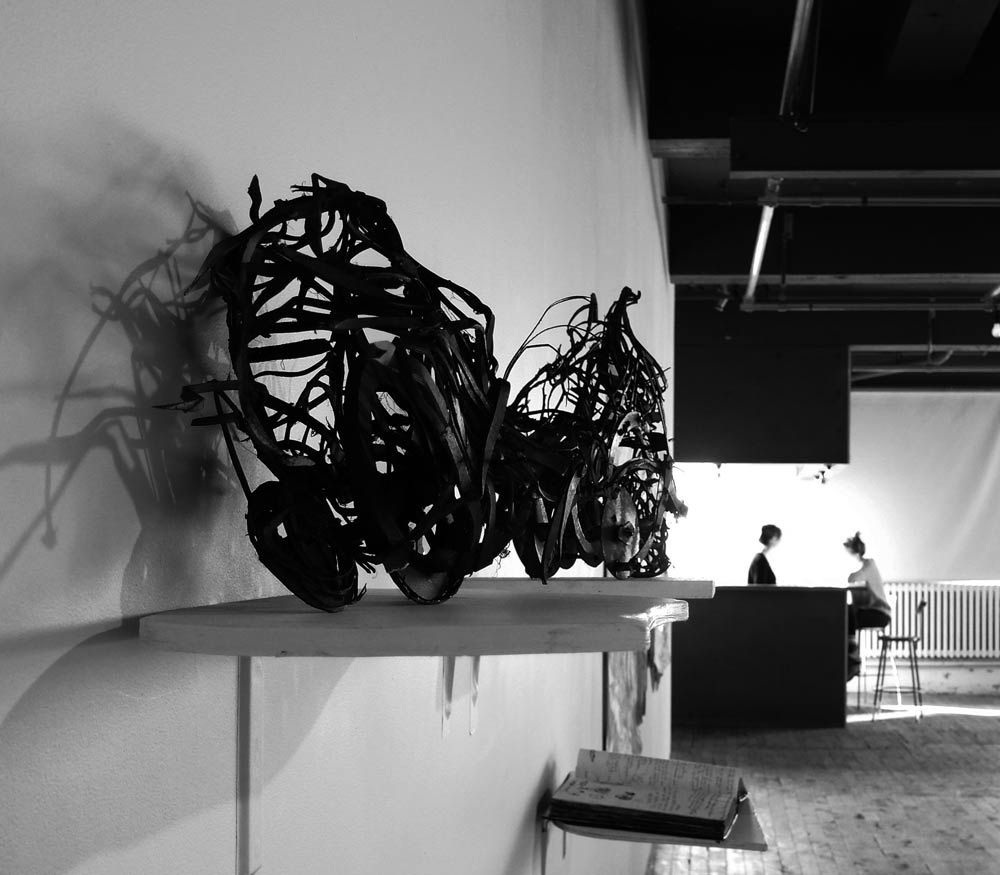 installation view of the paper maquettes and sketchbook during the Robotis Personae exhibition